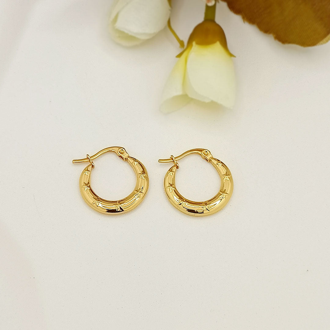 Gold star-engraved mini hoop earrings