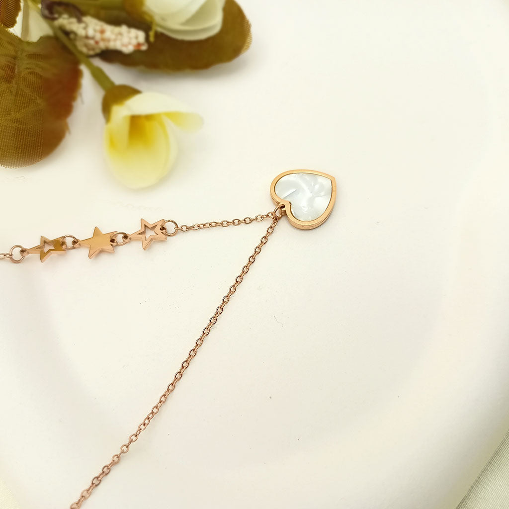 Heart pendant necklace with star accents