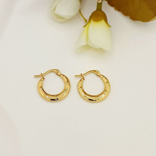Gold star-engraved mini hoop earrings