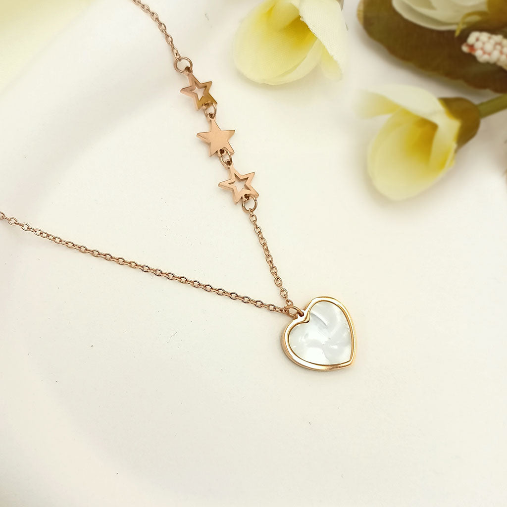 Heart pendant necklace with star accents