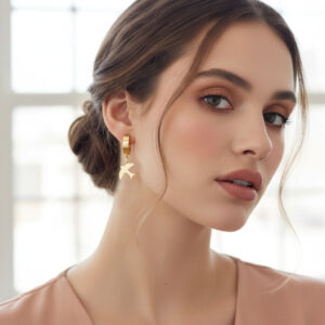 gold bird drop earrings