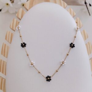 black & pearl floral station necklace